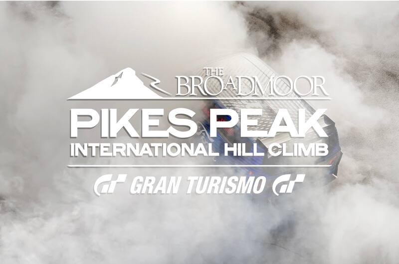Pikes Peak logo in white with background of SuperVan completing burnout